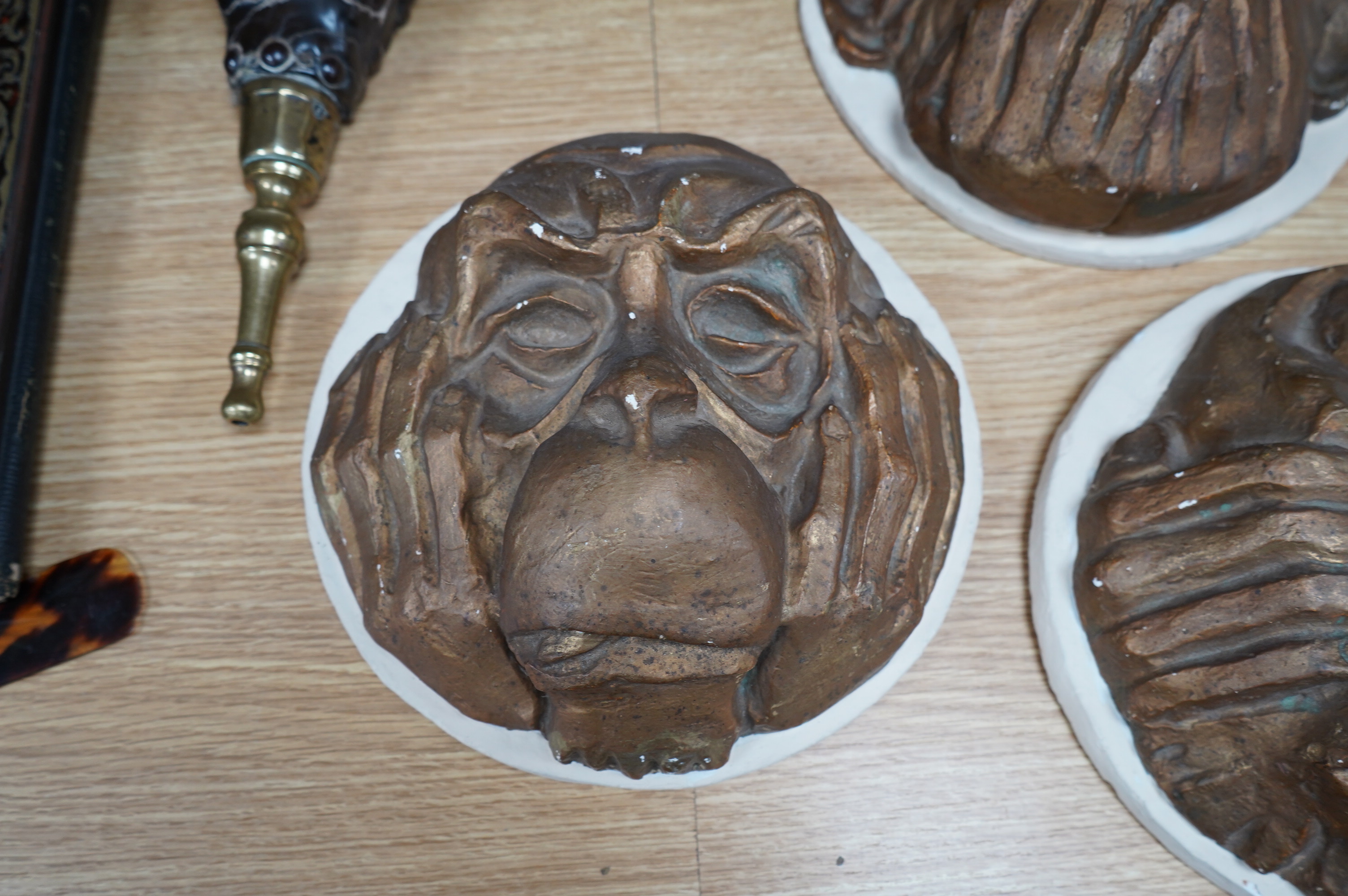 A set of ‘three wise monkeys’ plaster plaques, signed Alfred R. Martin, 22.5cm. Condition - fair to good